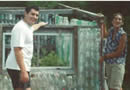 Volunteers and greenhouse - click for larger image