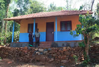 A family outside their new home A family outside their new home