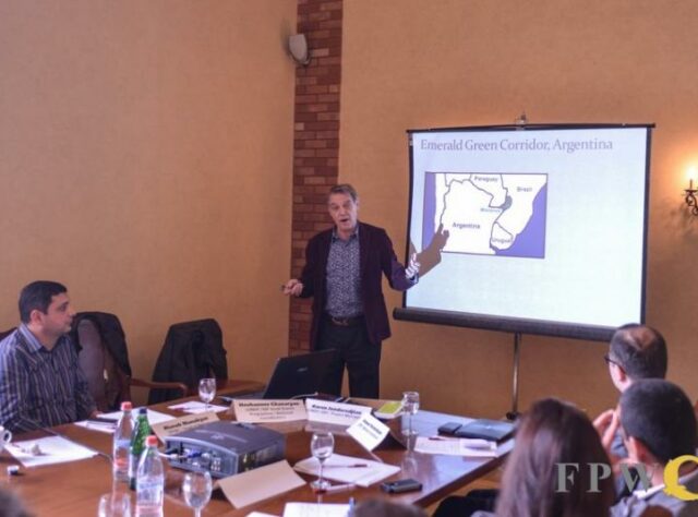 Photograph of John Burton presenting at the round table in Yevevan