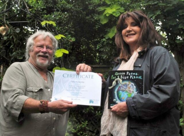 Photograph of Bill Oddie presenting Sally Peberday with her prize. © Chris Jenkin / Enterprise Plants.