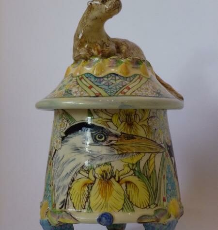Ceramic lidded pot with an otter on the top of the lid