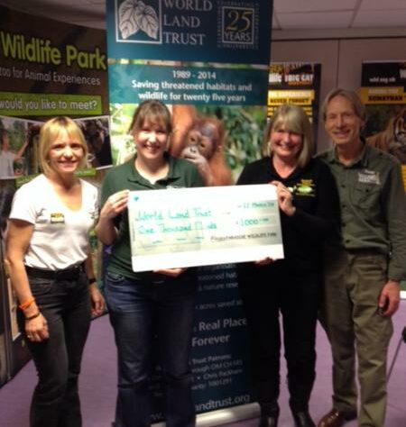 Representatives of Paradise Wildlife Park present Kelly Jacobs with a cheque for £1,000.