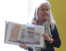 Nicola Davies holds up a copy of The Promise at Edgar Sewter Primary School assembly.