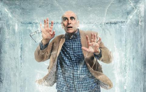 Man suspended in a block of ice.