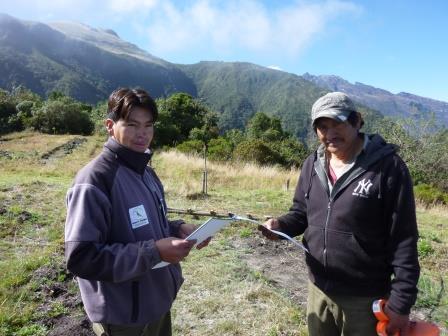 Silvio and Luis with mountains in the background.
