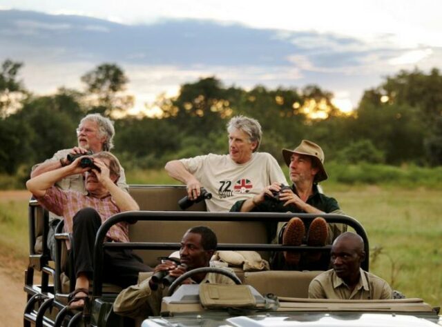 Bill Oddie in a jeep in Zambia