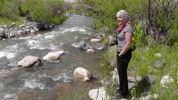Nicola Davies by a stream in Armenia.