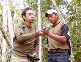 Ricardo Coc and Marco Cerezo examine a wildlife specimen.