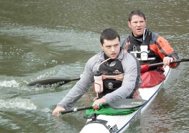 Steve Backshall and George Barnicoat in a kayak.