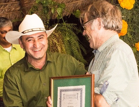 Ruben presents John with award