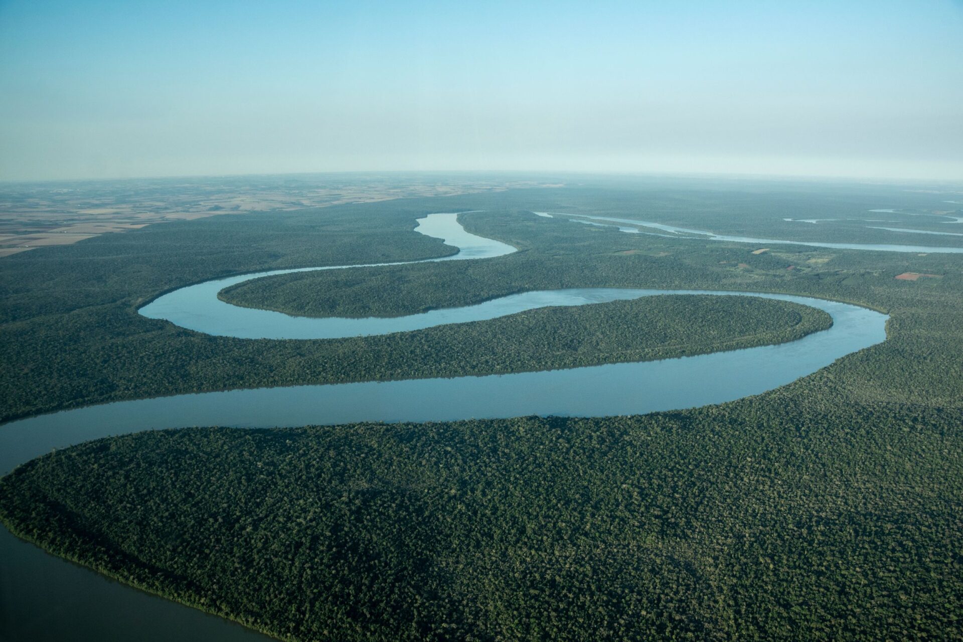 he Iguazú River winds its way along the border between Argentina and Brazil, travelling through some of the most biodiverse and yet most threatened forests on Earth. Credit: Vitormarigo/Shutterstock