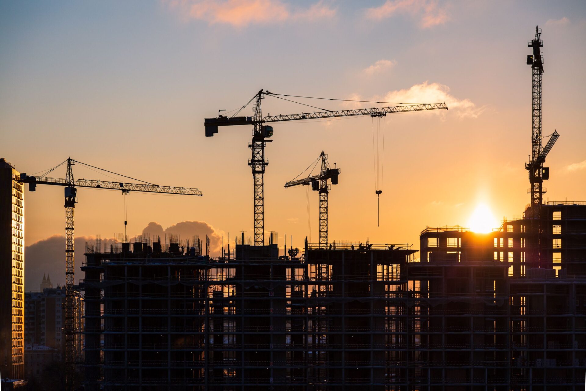 Cranes on a building site at sunset Credit: goncharovaia/iStock